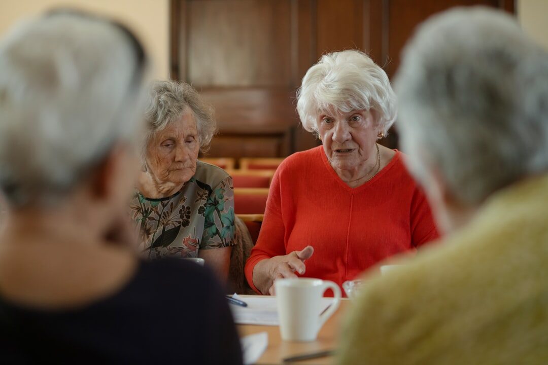 senior people having breakfast together